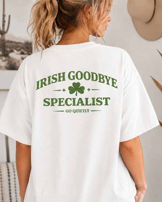 Women in a oversized white graphic t-shirt with the words Irish Goodbye Specialist on the back.