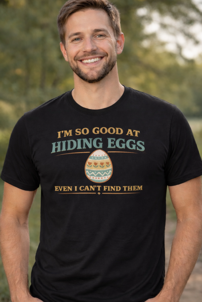 Man wearing a black t-shirt with a humorous graphic and text in an outdoor setting