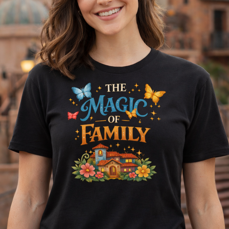 Woman wearing a black t-shirt with 'The Magic of Family' design in an outdoor setting.