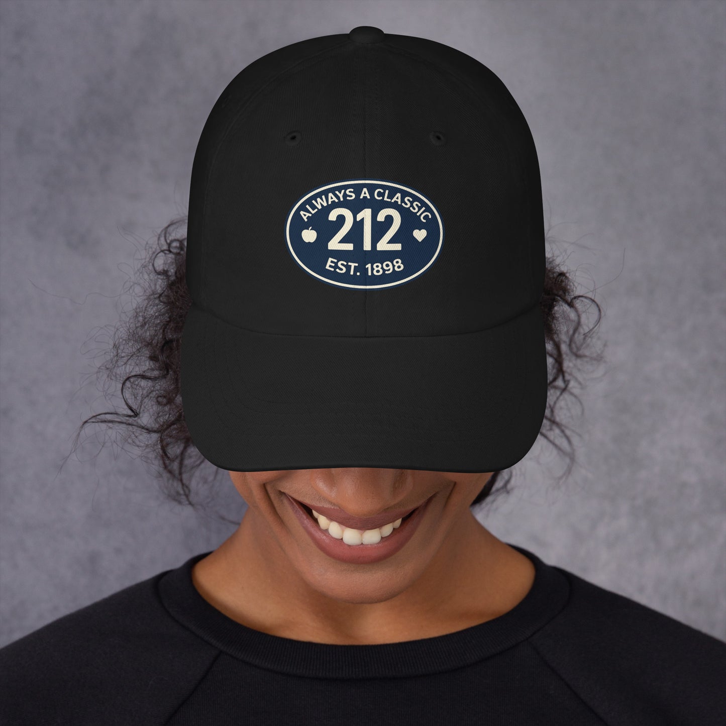 Black baseball hat with 212 embroidered on a smiling person.