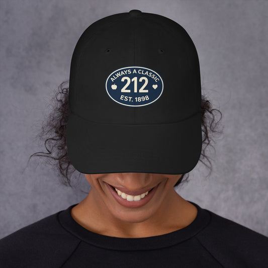 Black baseball hat with 212 embroidered on a smiling person.