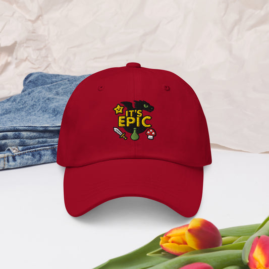 It’s Epic embroidered design on dad hat with dragon and fantasy icons 