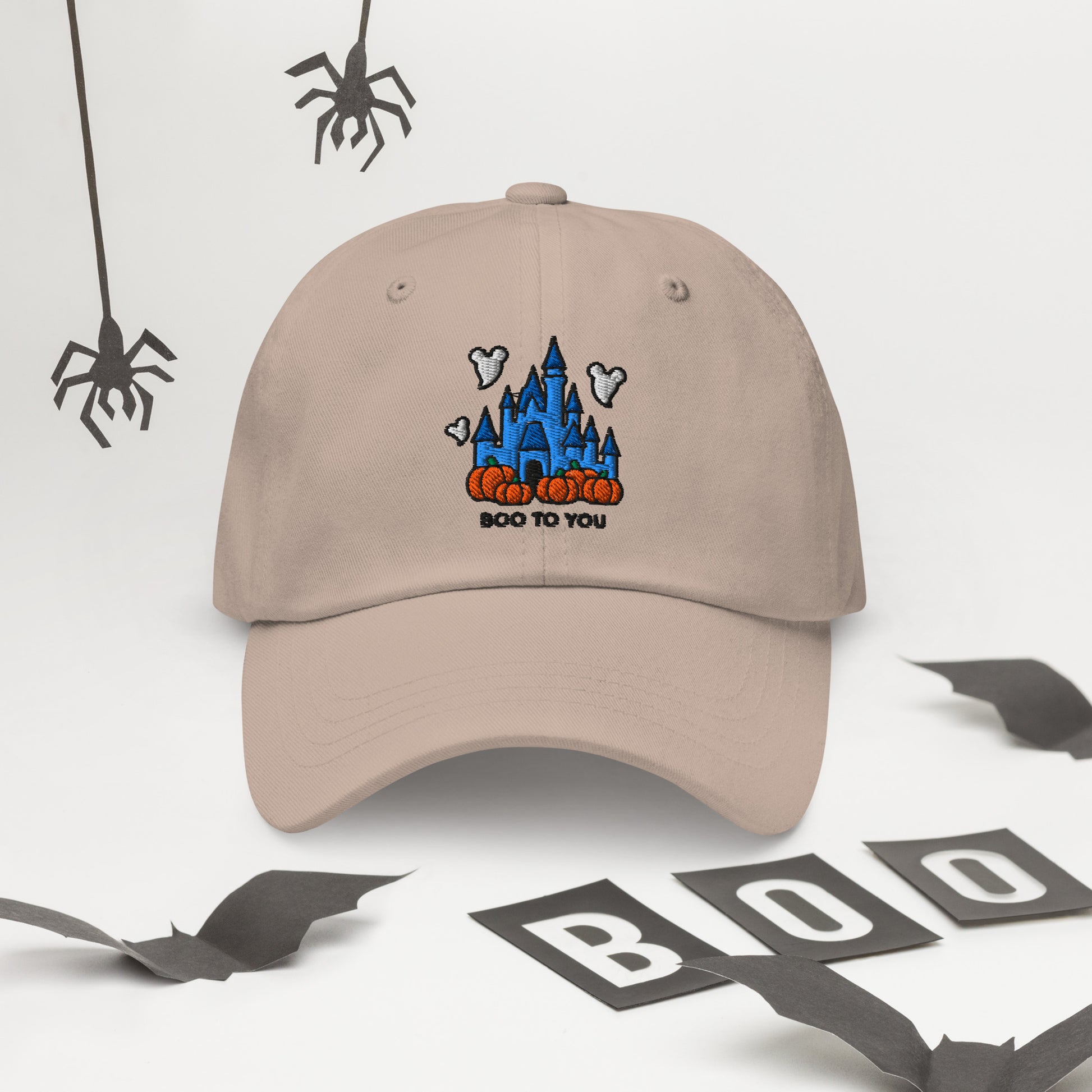 Disney Halloween dad hat with embroidered castle and Boo To You text, shown on a beige cotton cap