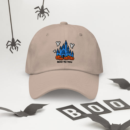 Disney Halloween dad hat with embroidered castle and Boo To You text, shown on a beige cotton cap