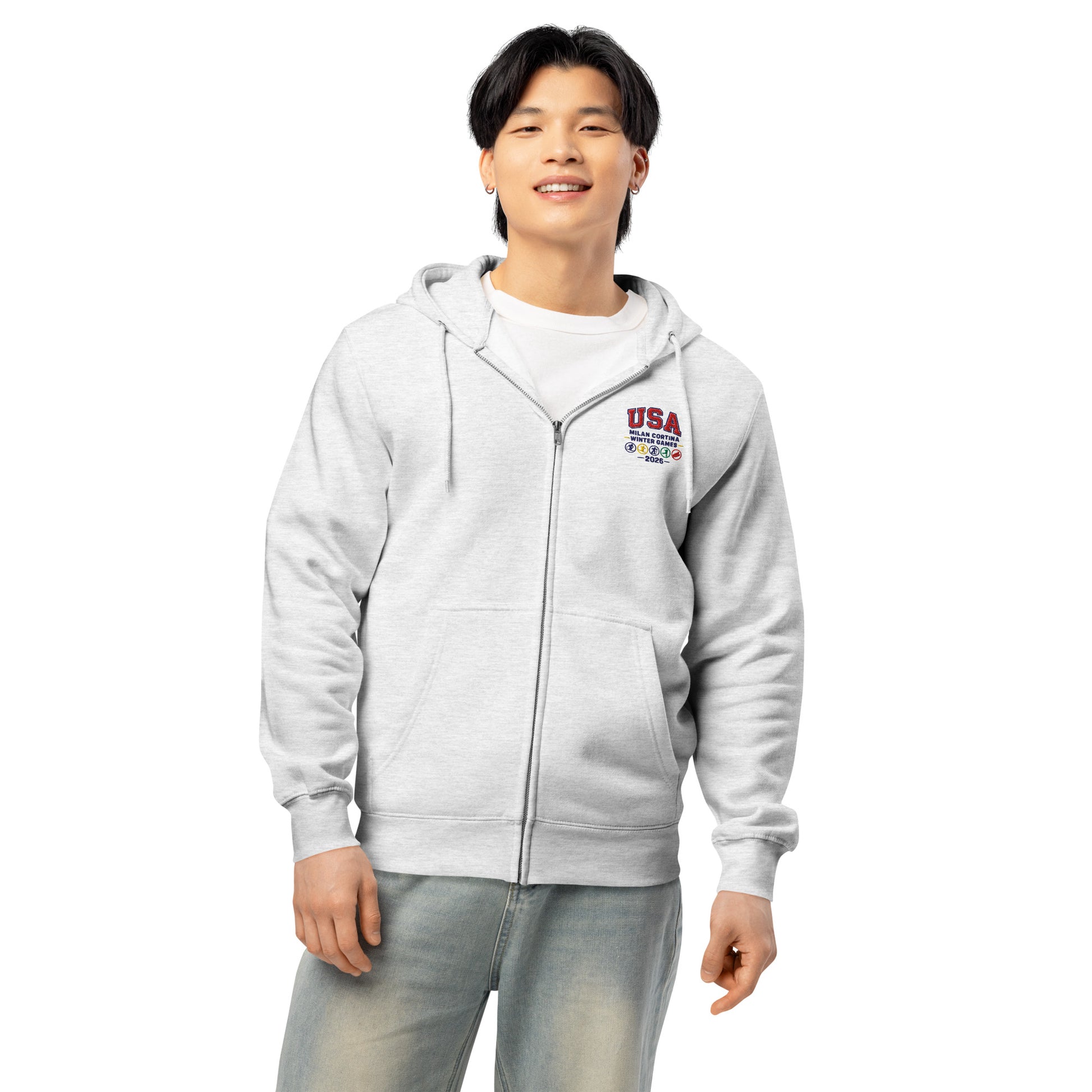 Man in gray zip hoodie that has embroidery that says USA against  white background.