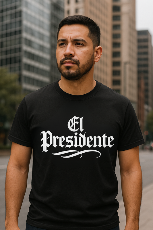 Man wearing a black t-shirt with 'El Presidente' text in an urban setting