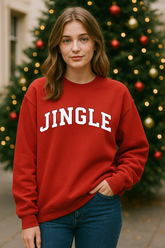 Lady wearing a red sweatshirt printed with JINGLE in front of a Christmas Tree.