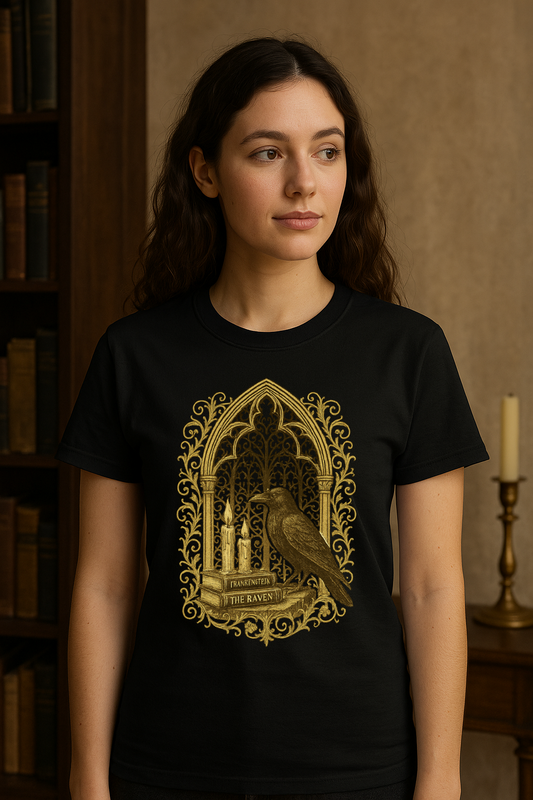 Woman wearing a black t-shirt with ornate gold gothic arch design featuring a raven, candles, and books labeled Frankenstein and The Raven.