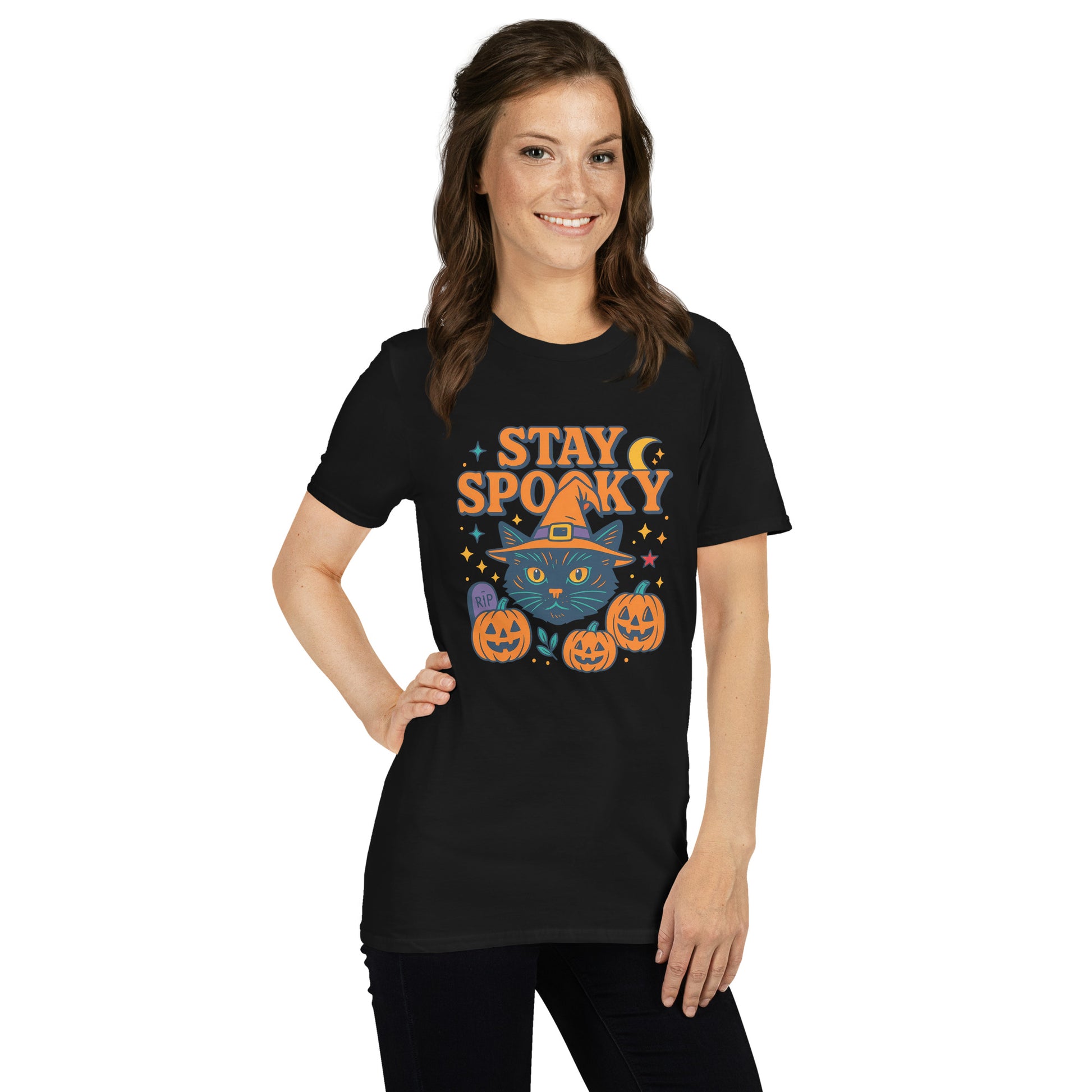 Lady in a black t-shirt with graphic black cat in witch hat and words stay spooky.