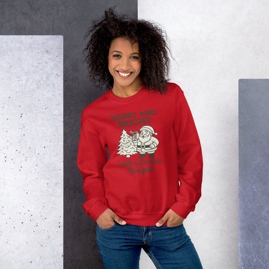 Women wearing a red sweatshirt that has Santa with a Cosmo against a grey backgound.