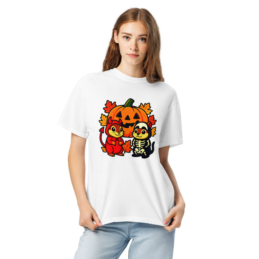 Person wearing a white t-shirt with Halloween-themed design featuring a chipmunks in costume, a pumpkin, skeleton, and leaf.