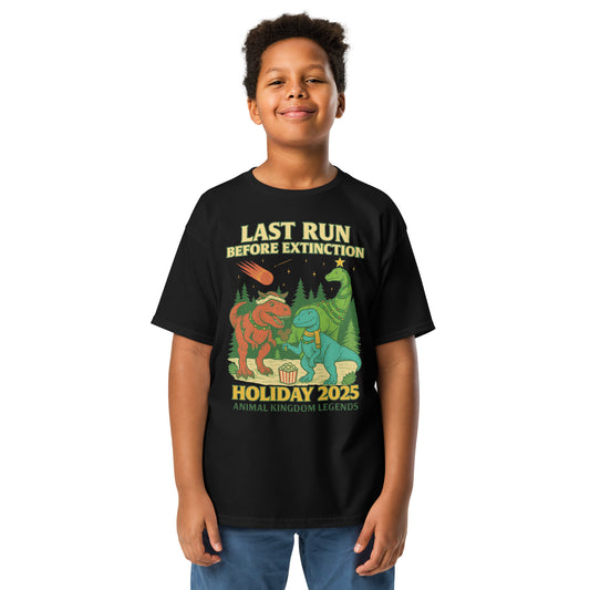 Boy in black t-shirt that has dinosaurs celebrating the Holiday.