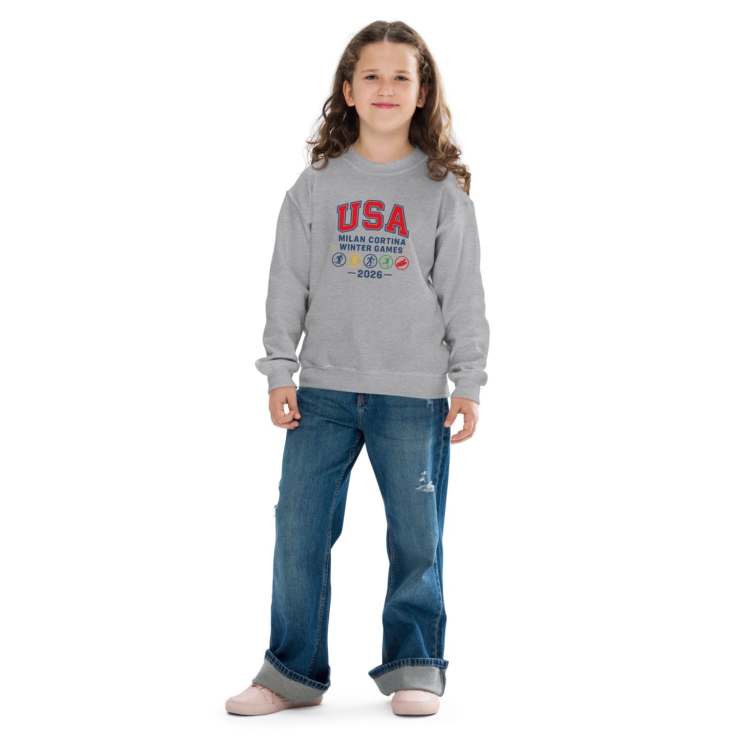 Girl in blue jeans and a gray sweatshirt that says USA and Milan Cortina Winter Games.
